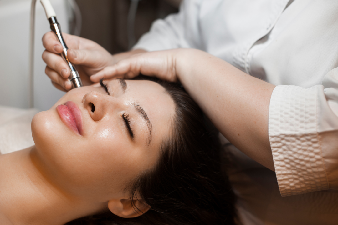  A woman receiving an anti-aging treatment with a specialized device.