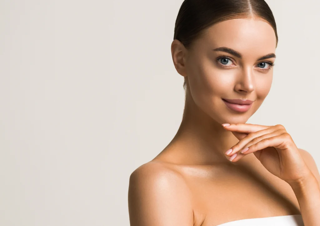 A woman with radiant, smooth skin after a microneedling treatment.