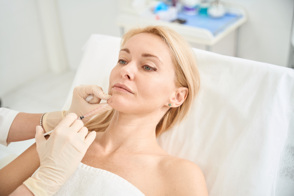 Woman receiving Letybo injection in a professional med spa setting.